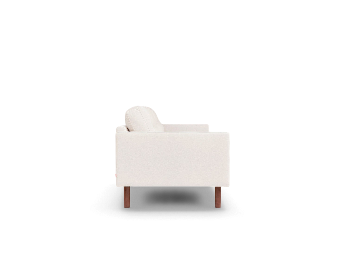 urbane EQ3 Miller sofa in cream fabric with channel-stitched cushions and walnut-finished solid ash wood legs