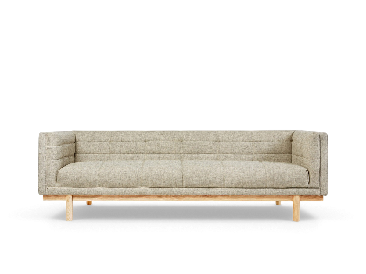 urbane EQ3 Mulholland sofa in beige fabric with blind-tufting and solid ash wood base in a modern tuxedo style