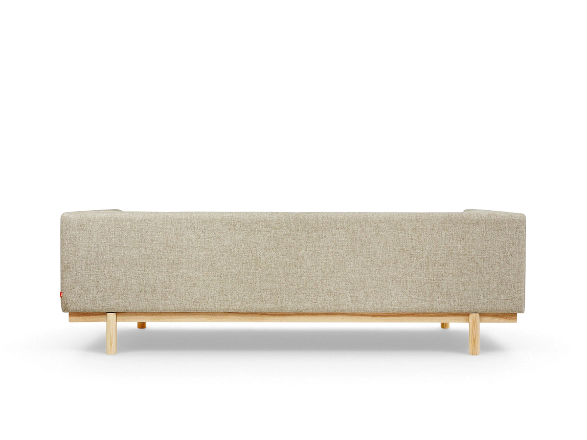 urbane EQ3 Mulholland Sofa in beige fabric with a solid ash wood base, viewed from the back.