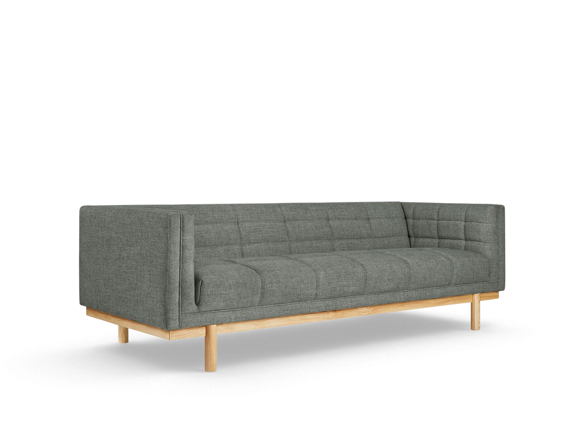 urbane EQ3 Mulholland sofa in grey fabric with a tuxedo frame, blind-tufting, and a solid ash wood base.