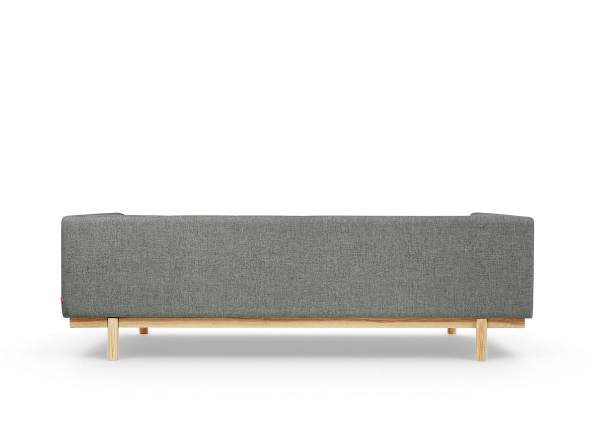 urbane EQ3 Mulholland Sofa in grey fabric with a solid ash wood base, shown from the back view.