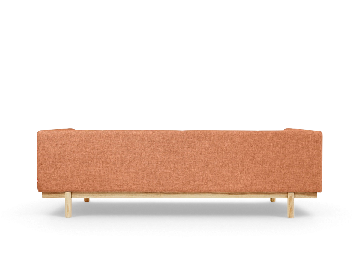 urbane EQ3 Mulholland Sofa in burnt orange fabric with a solid ash wood base and dowel legs, back view