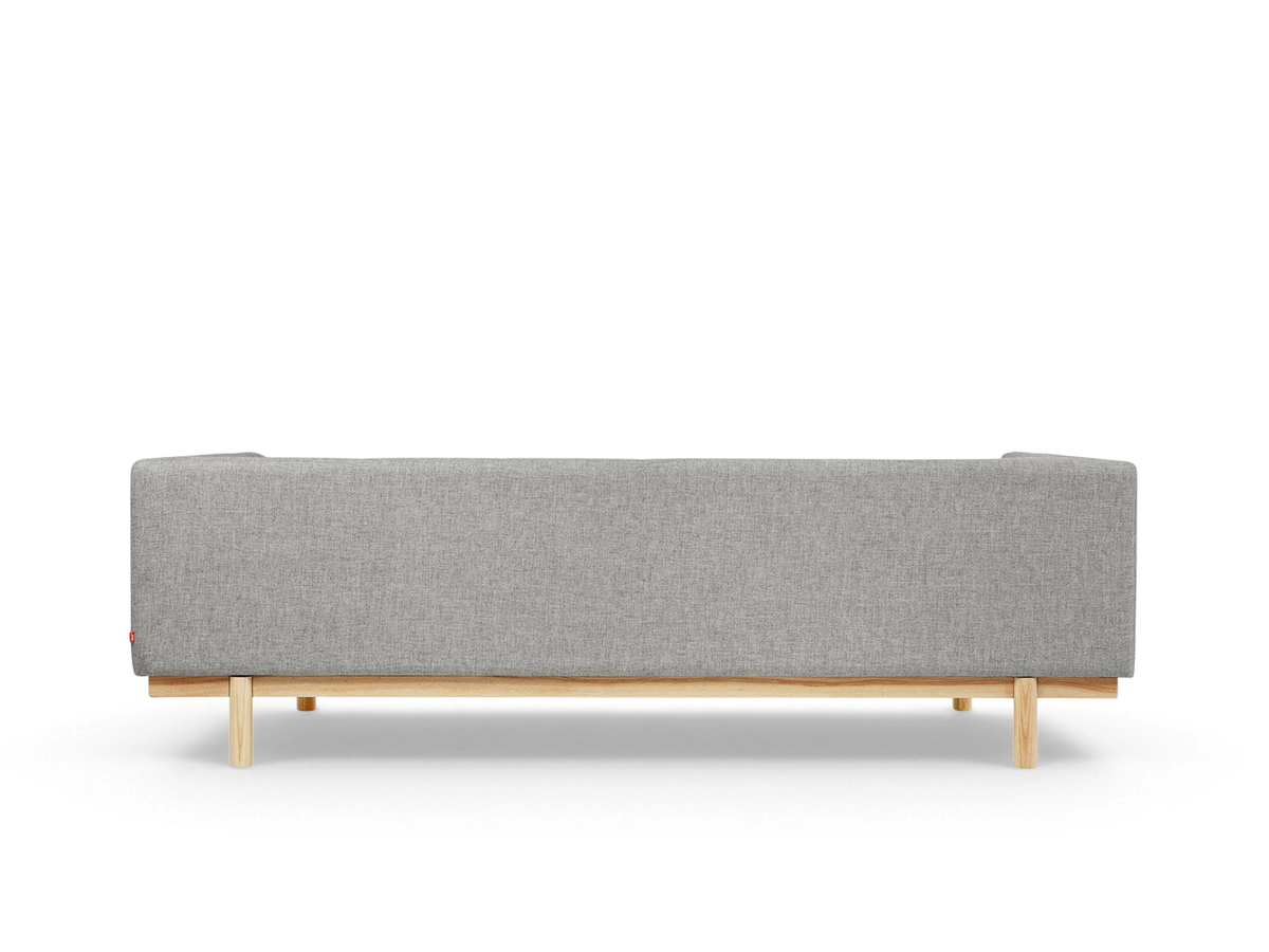 urbane EQ3 Mulholland Sofa in grey fabric with a solid ash wood base, viewed from the back
