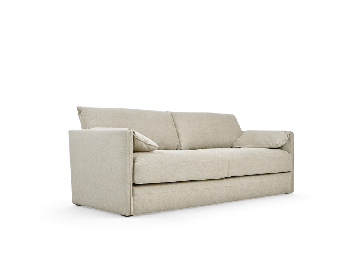 urbane EQ3 Neru sofabed in a neutral beige fabric with slender arms, integrated bolsters, and French-seam detailing.