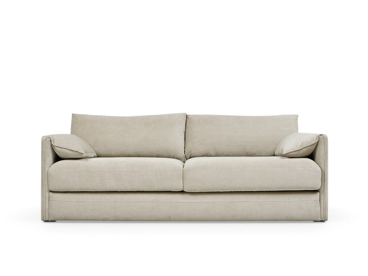 urbane EQ3 Neru Sofabed in light beige fabric with French-seam arms, feather-filled cushions, and integrated bolsters.