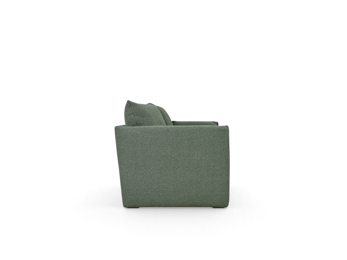 urbane EQ3 Neru Sofabed in sage green textured fabric, side profile view showing slender arms and French seam detail