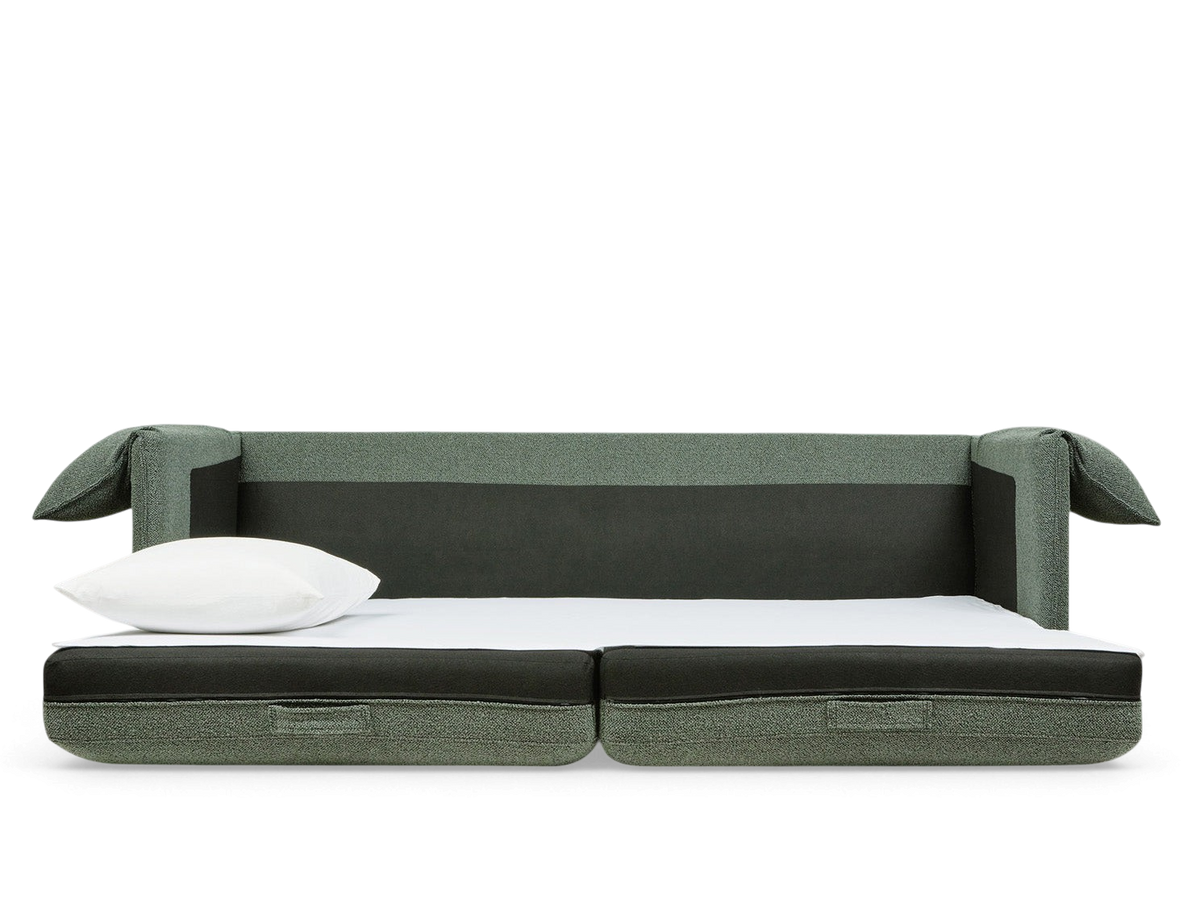urbane EQ3 Neru Sofabed in green fabric with integrated bolsters and white top sheet in a modern living room setting