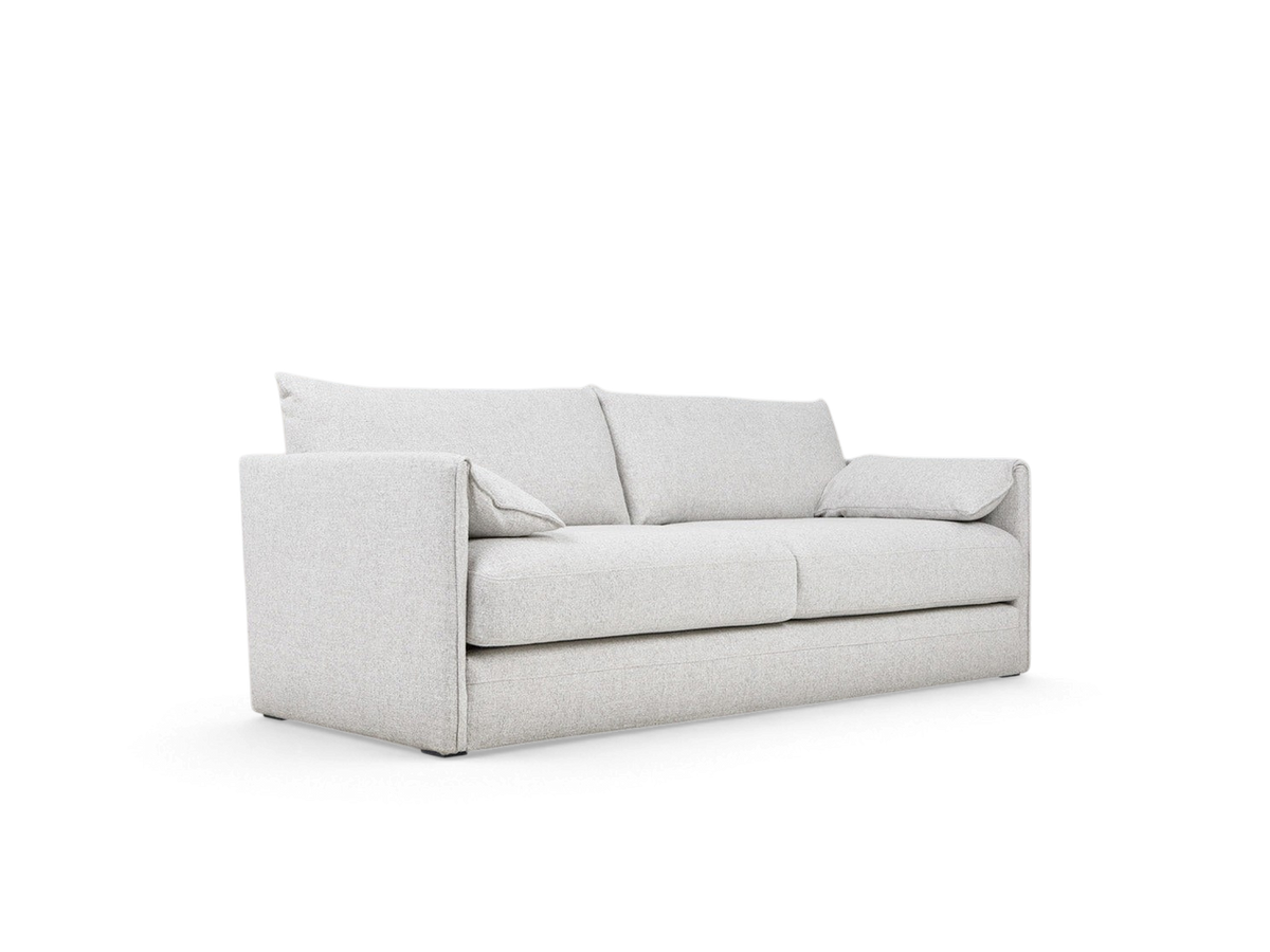 urbane EQ3 Neru Sofabed in light grey fabric with slender arms, French seam detailing, and integrated bolsters.