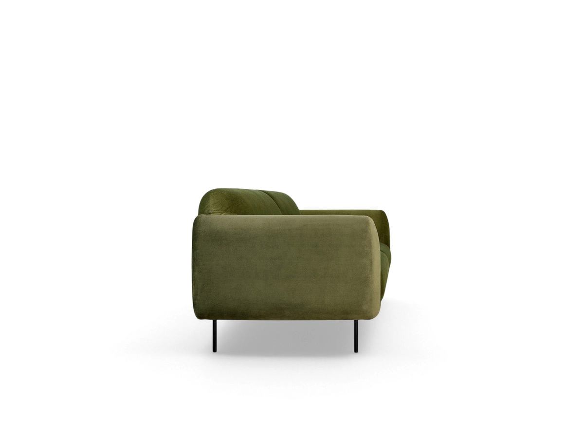 urbane EQ3 Nord Sofa in green velvet with a curved silhouette and black steel legs, side view.