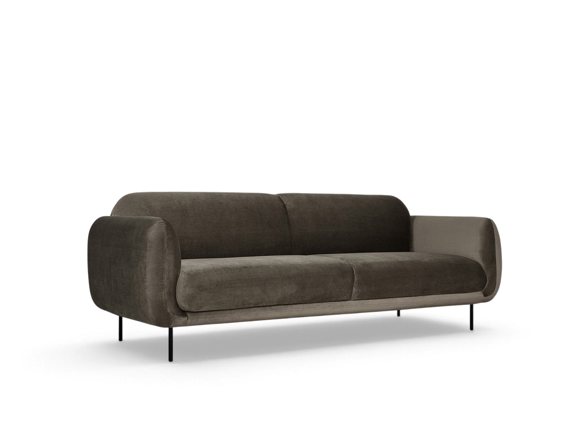 urbane EQ3 Nord Sofa in dark grey fabric with a curved silhouette and black steel legs in a minimalist studio setting