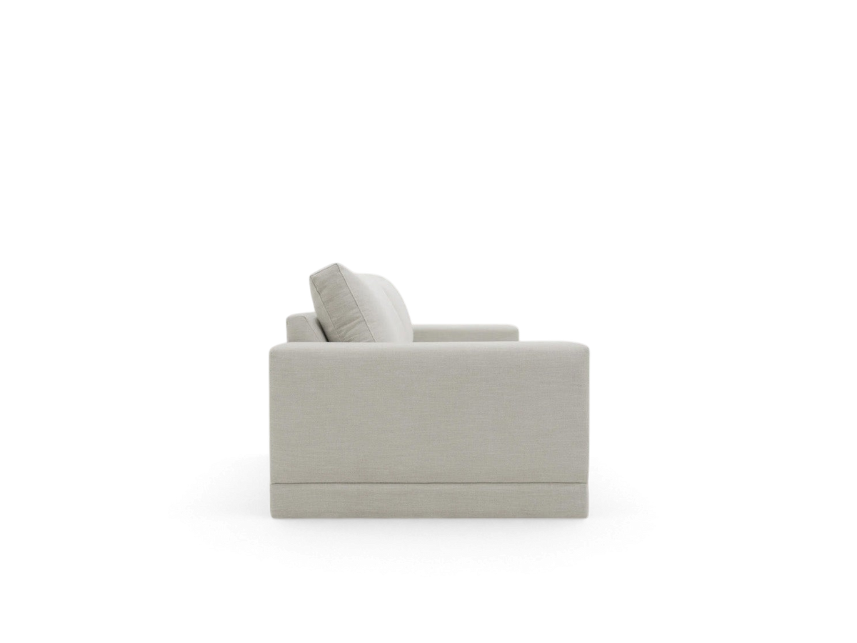 urbane EQ3 Palermo sofa in a light neutral fabric, shown from a side profile view with clean top-stitched detailing.