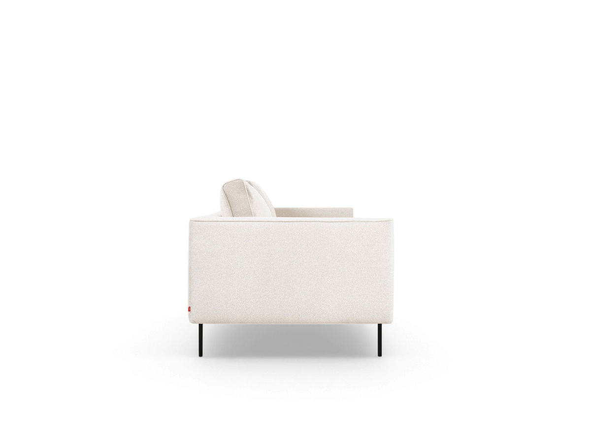 urbane EQ3 Renfrew sofa in a light neutral fabric with a tuxedo frame and black powder-coated steel legs side view