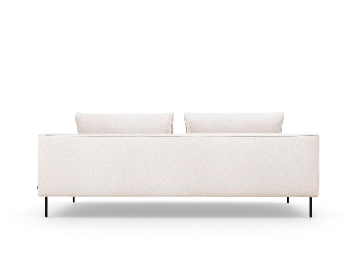 urbane EQ3 Renfrew sofa in cream fabric with a tuxedo frame and black powder-coated steel legs, back view.
