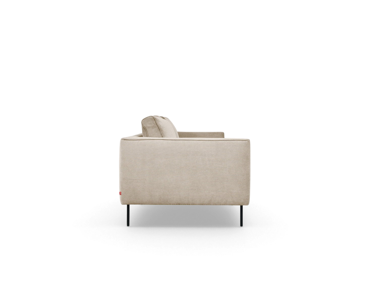 urbane EQ3 Renfrew sofa in a neutral fabric with a tuxedo frame and black tubular steel legs, side profile view.