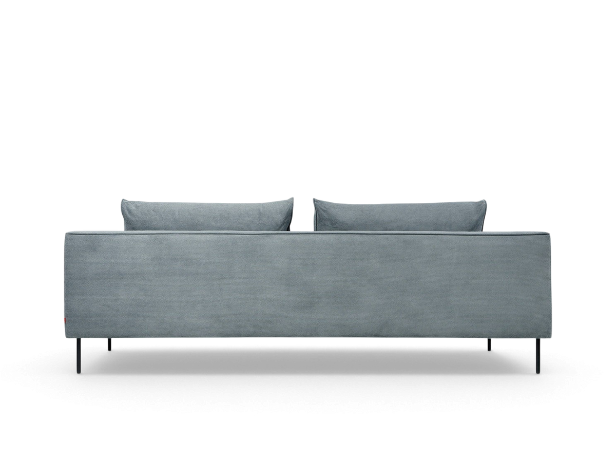 urbane EQ3 Renfrew sofa in light blue fabric with a tuxedo frame and slim black tubular steel legs, back view