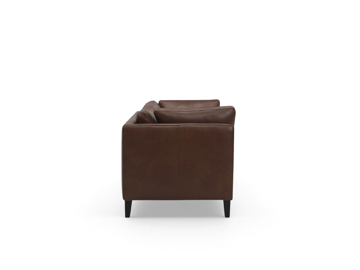 Side profile of the urbane EQ3 Salema 92 inch sofa in brown leather with a sleek modern design and dark wood legs.