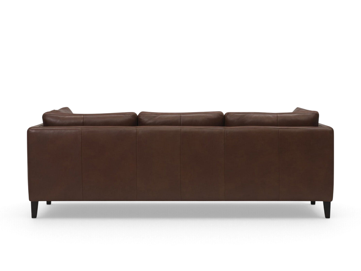 Back view of the urbane EQ3 Salema 92 inch sofa featuring rich brown leather upholstery and dark tapered wooden legs.