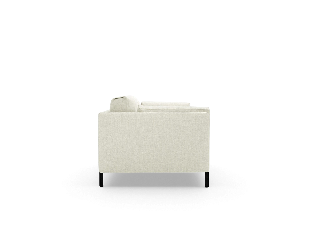 urbane EQ3 Silverlake sofa side view featuring a minimalist tuxedo frame, light fabric upholstery, and black steel legs.