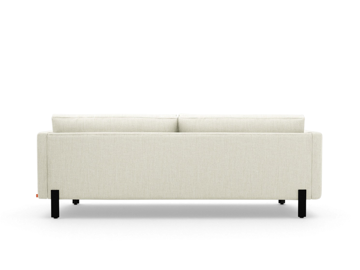 urbane EQ3 Silverlake sofa in light beige fabric with a tuxedo frame and black powder-coated steel legs, back view