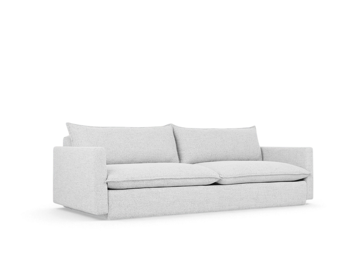 urbane EQ3 Sola Sofa in light grey fabric with plush cushions, French-seam detailing, and a modern low-profile design.