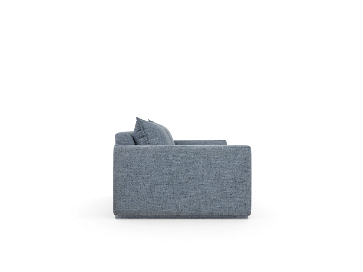 urbane EQ3 Sola Sofa in blue fabric with French-seam detailing, shown from a side profile view.