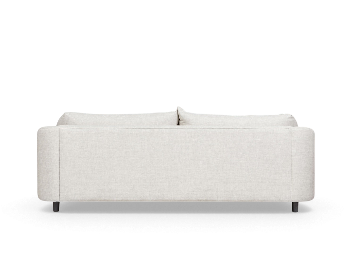 urbane EQ3 Thalia sofa viewed from the back, featuring a clean minimalist design with light fabric upholstery.