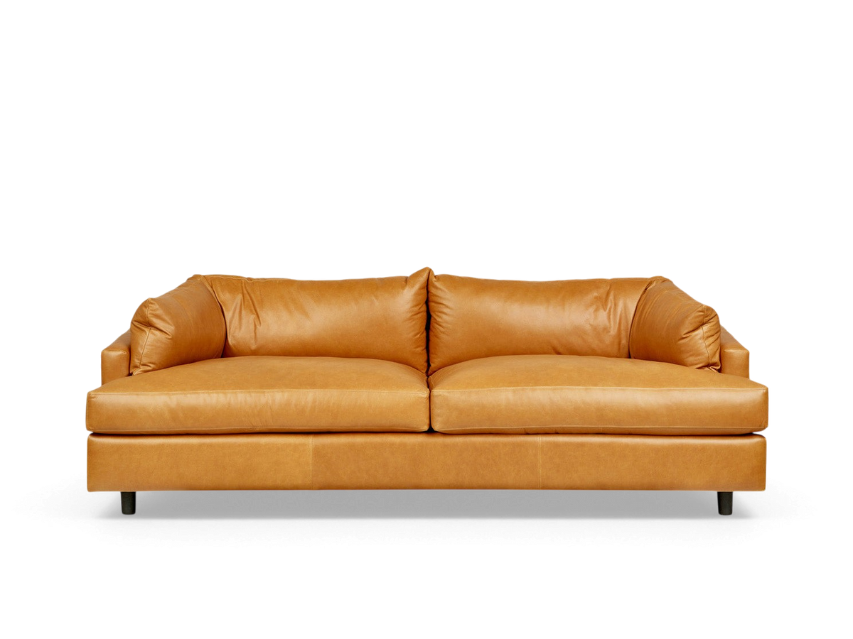 urbane EQ3 Thalia sofa in tan top grain leather with a low-profile, modern 1970s-inspired design.