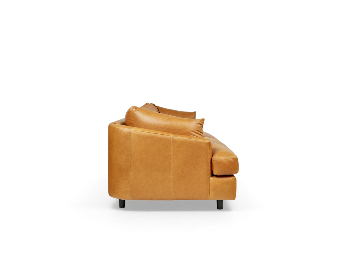urbane EQ3 Thalia sofa in tan top grain leather with a 1970s Italian modern design and wraparound cushions