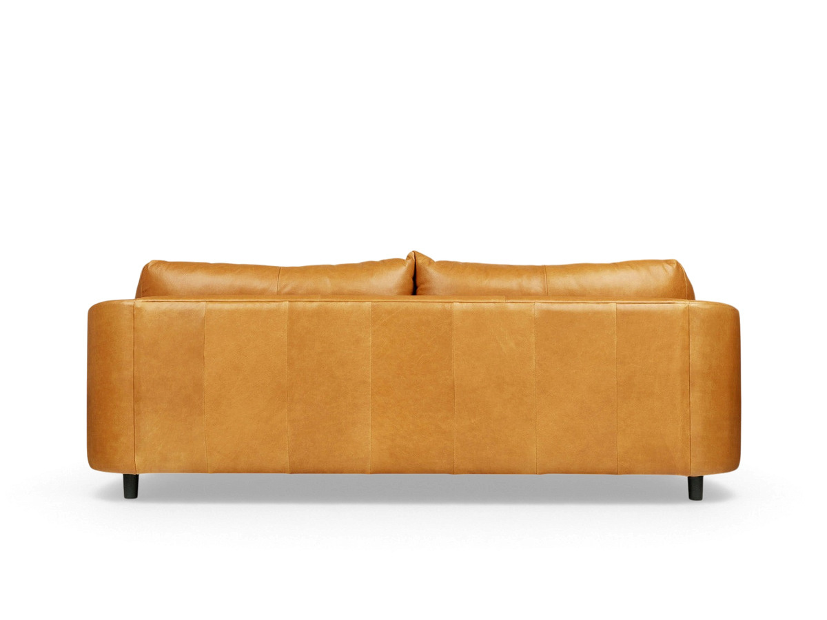 urbane EQ3 Thalia sofa in tan top grain leather with a 1970s-inspired modern design and wraparound cushions.