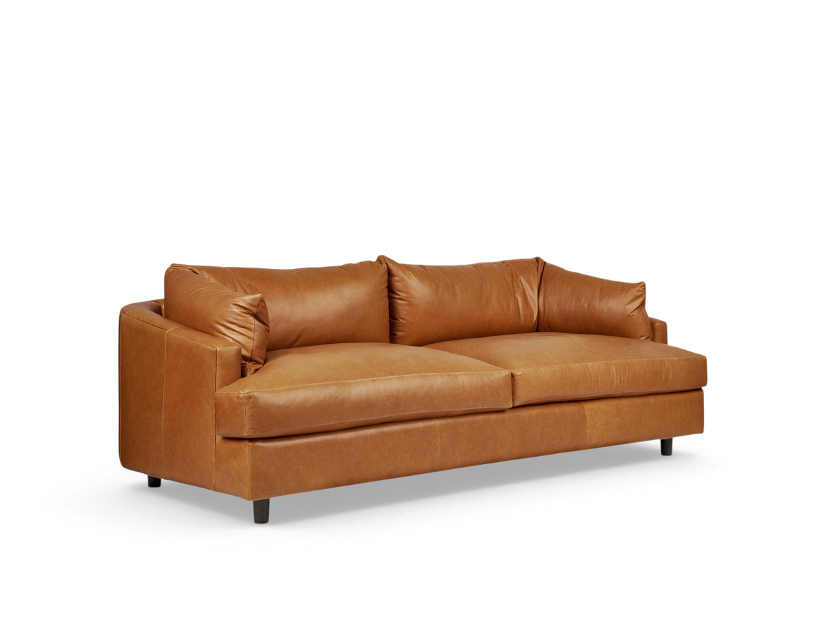 urbane EQ3 Thalia sofa in tan top grain leather with a modern 1970s-inspired wraparound cushion design