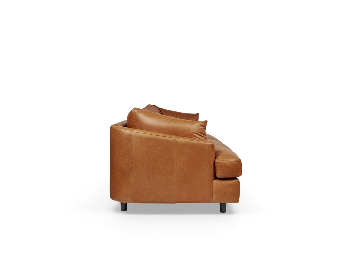urbane EQ3 Thalia sofa in tan top grain leather with a modern wraparound cushion design, side view