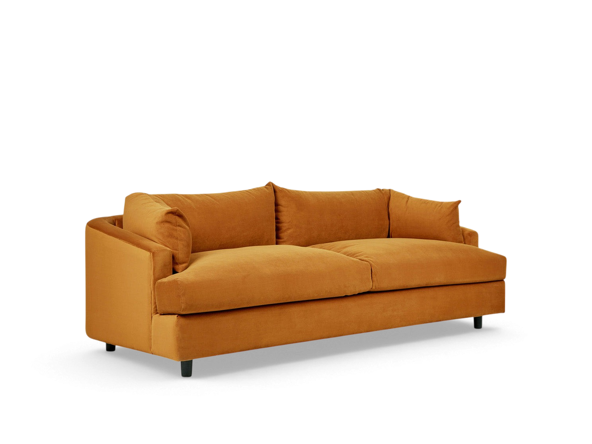 urbane EQ3 Thalia sofa in mustard yellow fabric with a modern 1970s-inspired wraparound cushion design