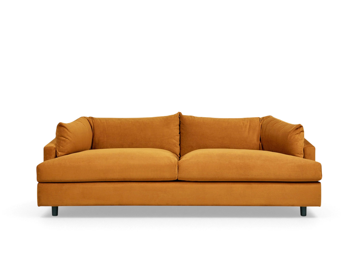 urbane EQ3 Thalia sofa in a warm ochre fabric with a modern 1970s-inspired wraparound cushion design