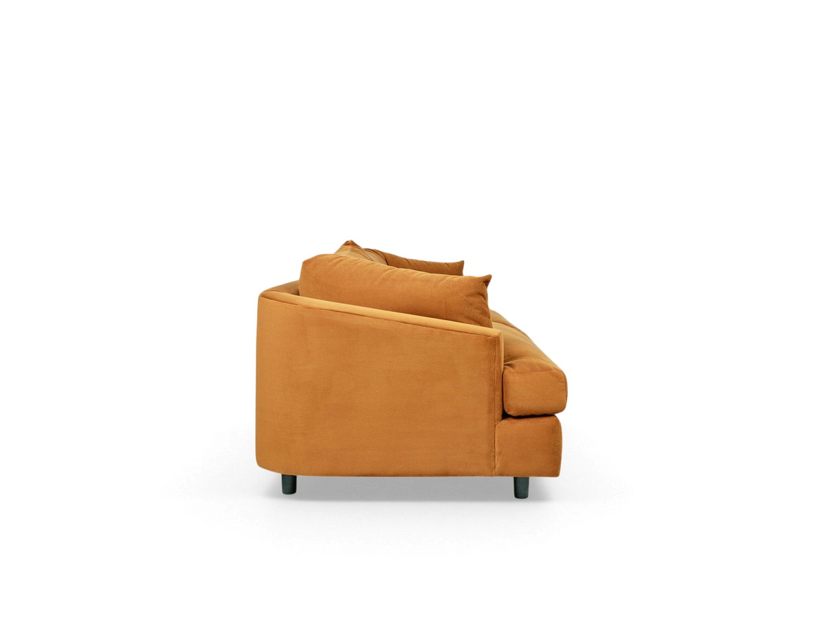 urbane EQ3 Thalia sofa in a warm ochre fabric with a modern wraparound design, side profile view.