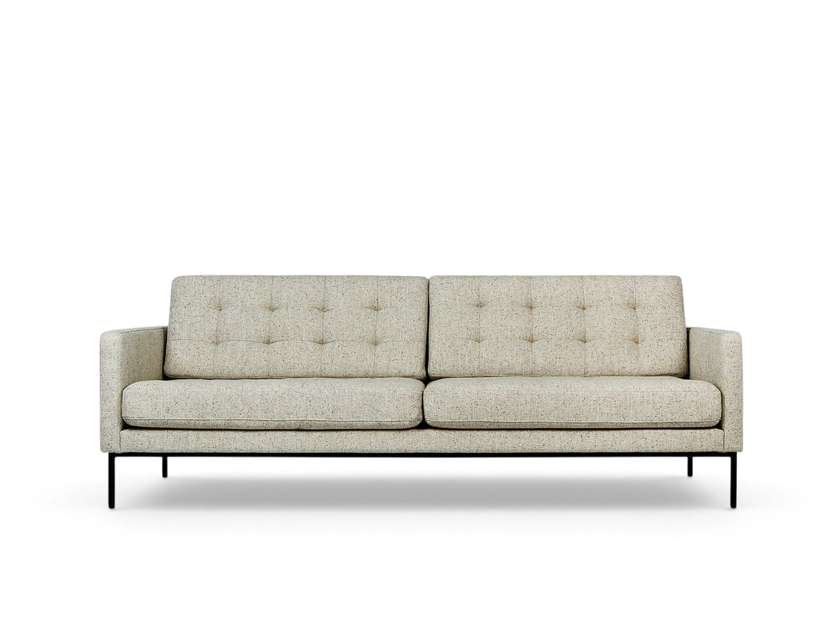 urbane EQ3 Towne Sofa in a light textured fabric with blind-tufted cushions and black powder-coated steel legs.