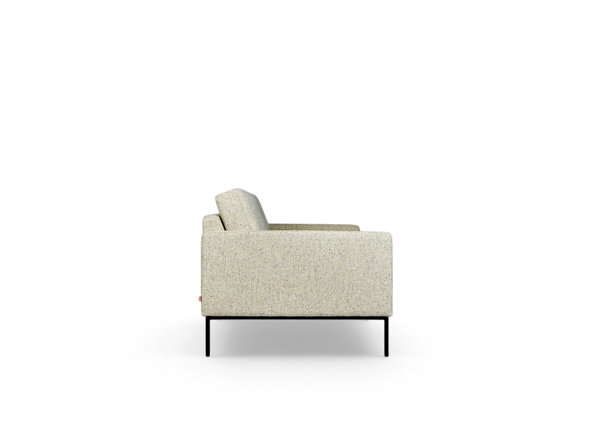 Side profile of the urbane EQ3 Towne Sofa in a light speckled fabric with black powder-coated steel legs.
