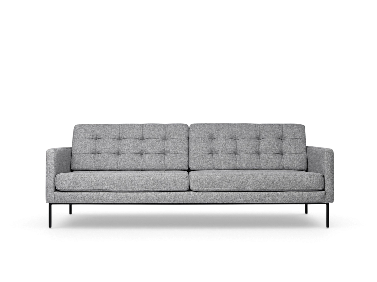 urbane EQ3 Towne Sofa in grey fabric with blind-tufted cushions and slender black metal legs in a mid-century style.