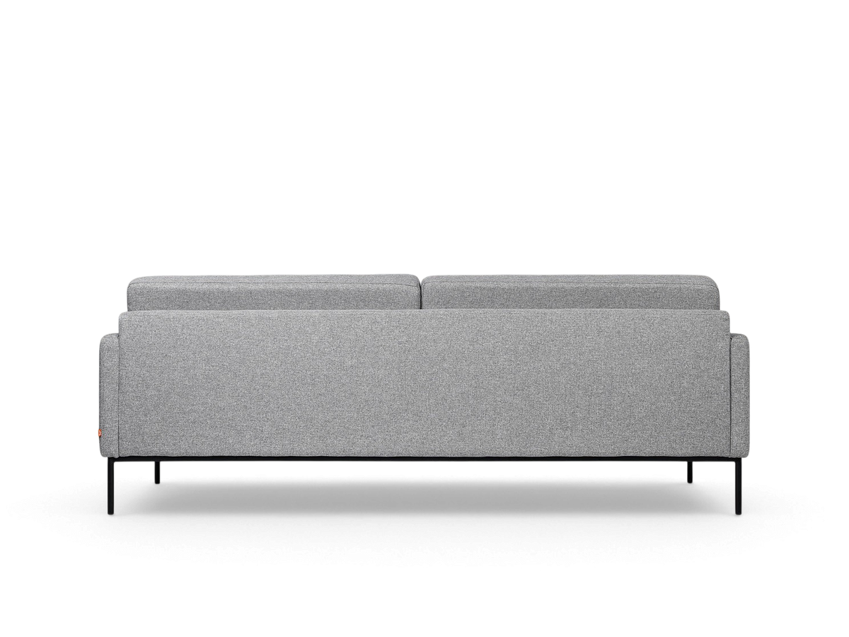 Back view of the urbane EQ3 Towne Sofa in grey fabric with a slender black powder-coated steel base.