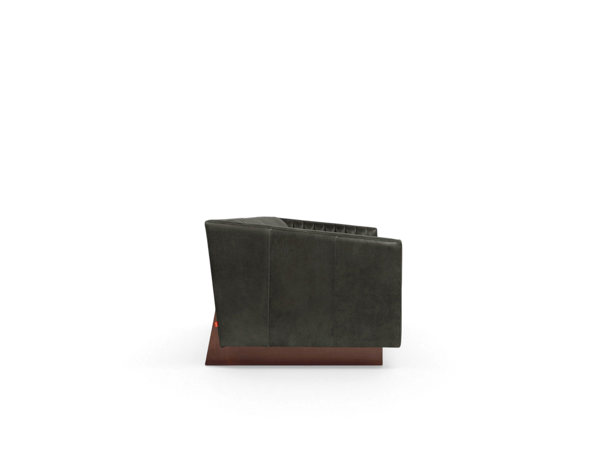 urbane EQ3 Wallace Sofa side view featuring dark leather upholstery, channel stitching, and a walnut wood base.