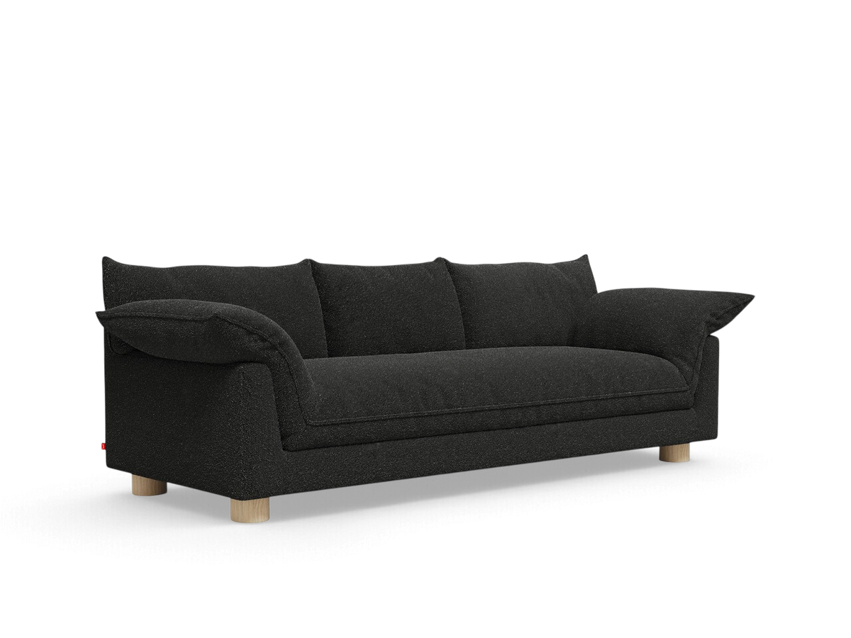 urbane EQ3 Zoe sofa in dark charcoal fabric with French seams and light oak circular legs against a white background