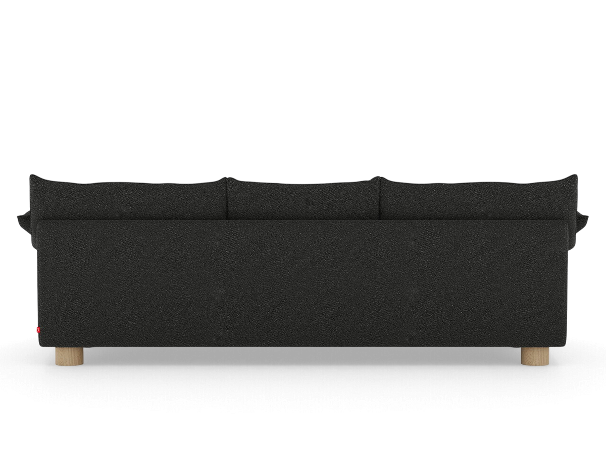 Back view of the urbane EQ3 Zoe sofa in dark grey fabric with light oak circular legs and French-seam detailing.