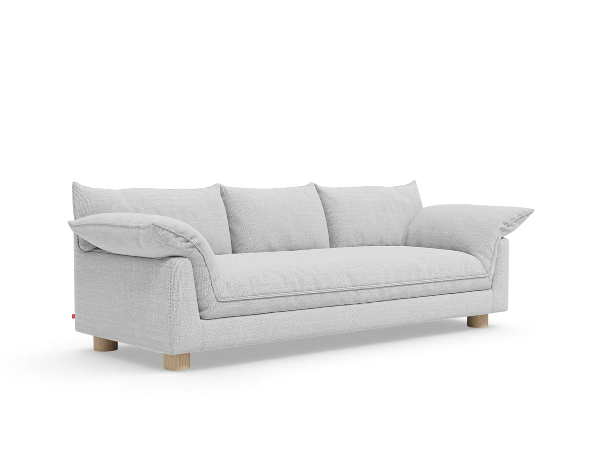 urbane EQ3 Zoe sofa in light grey fabric with French seam details and round oak legs on a white background