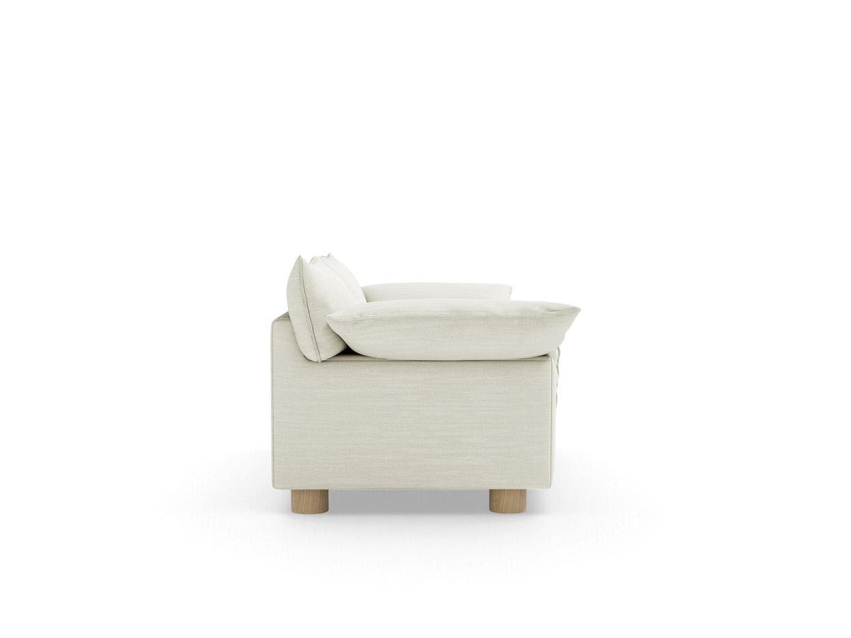 urbane EQ3 Zoe sofa in a neutral fabric with French seam detailing and round oak legs, side profile view