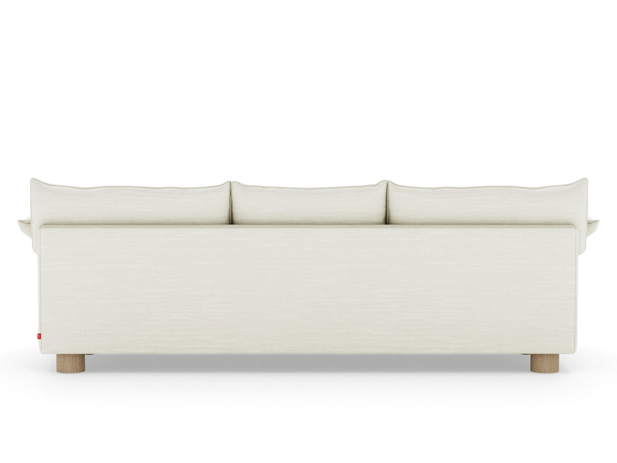 urbane EQ3 Zoe sofa in a neutral fabric with French seam detailing and round oak legs, viewed from the back.