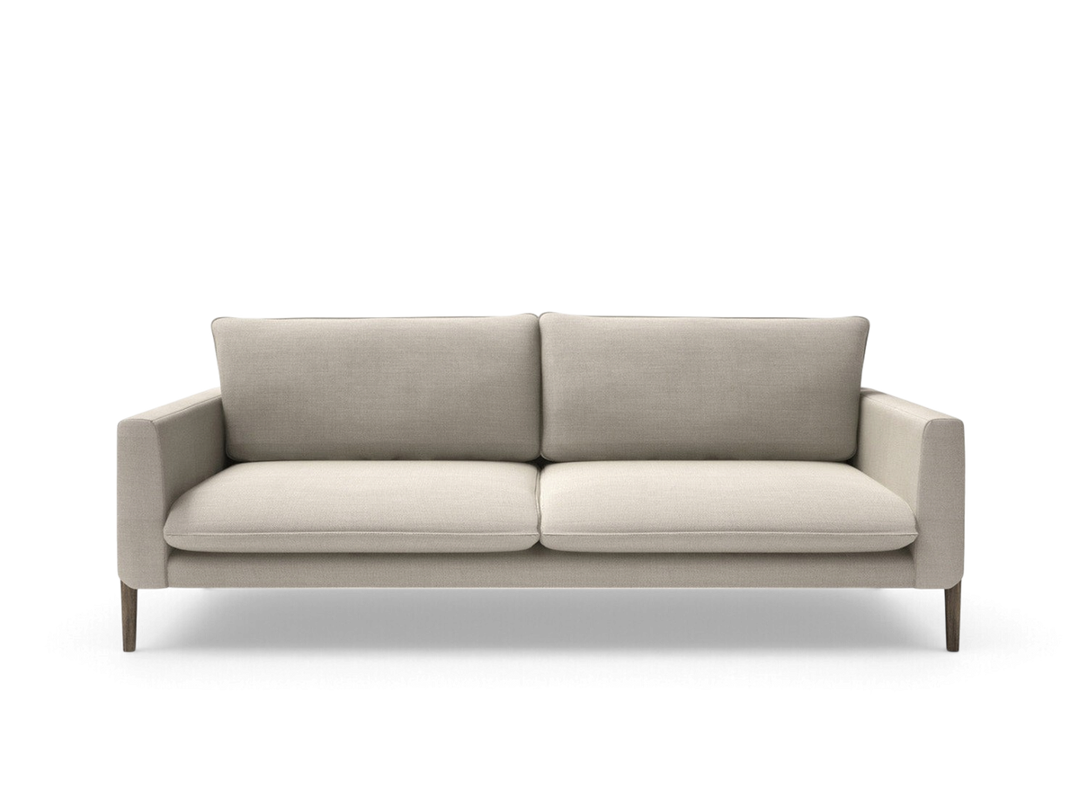 urbane EQ3 Charles sofa in beige fabric with slim armrests and solid birch legs, front view