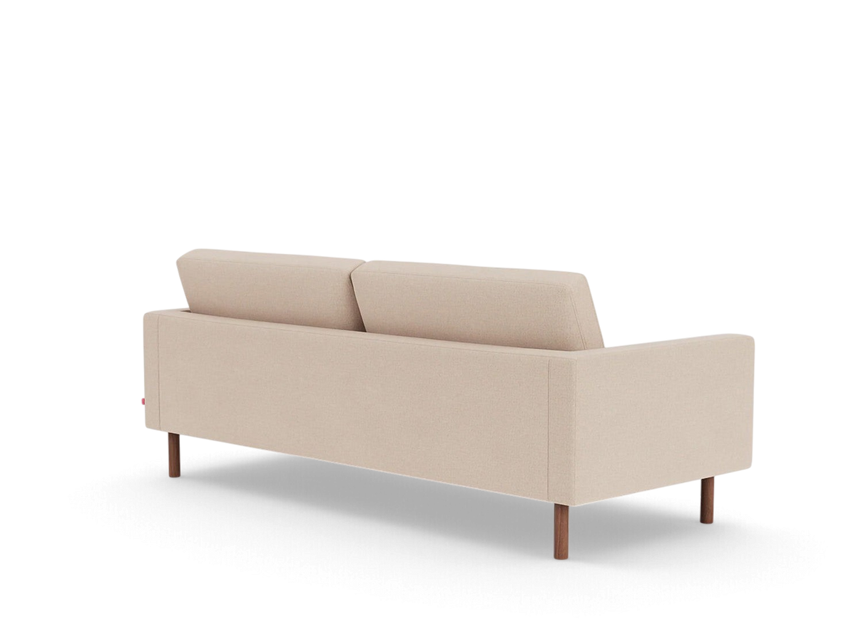 Back view of the urbane EQ3 Joan 83 inch mid-century sofa in beige fabric with dark wooden legs