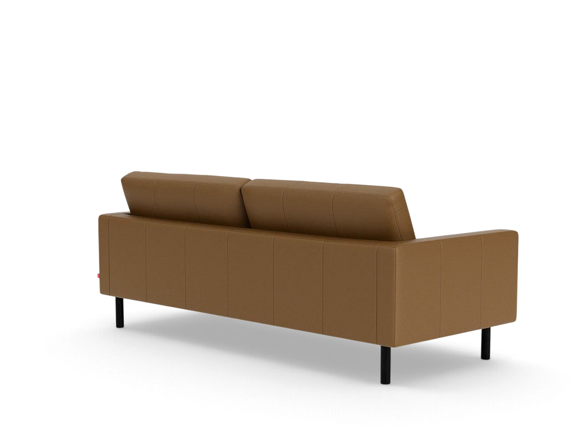 urbane EQ3 Joan 83 inch mid-century modern sofa in tan leather with tufted back and black legs, rear view