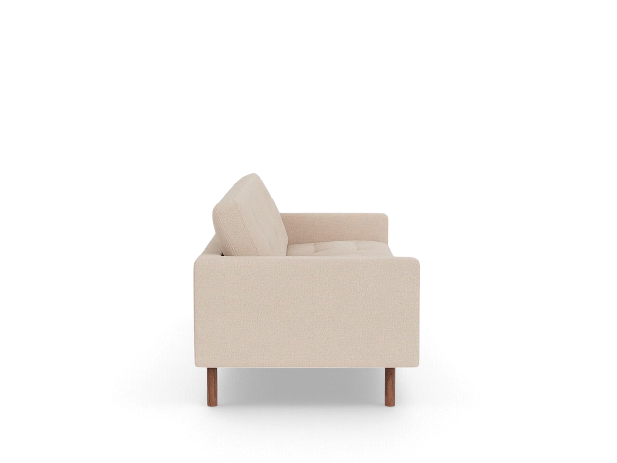 urbane EQ3 Joan 87 inch mid-century modern sofa in beige fabric with tufted cushions and wooden legs, side view