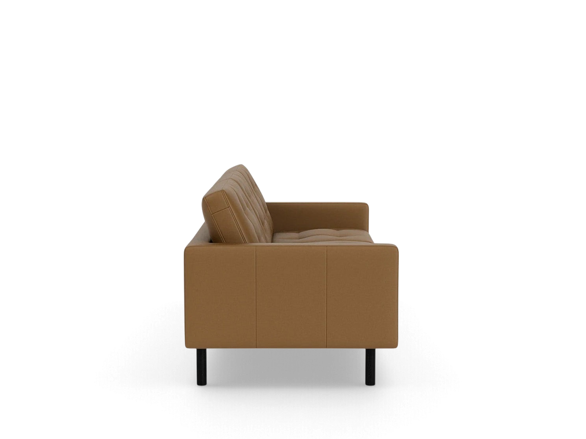 urbane EQ3 Joan 87-inch mid-century modern sofa in tan leather with tufted cushions and black legs, side view