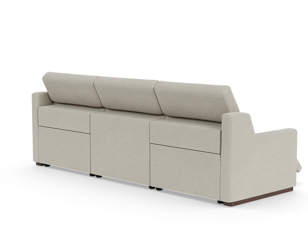 urbane EQ3 Laze reclining sofa in a neutral beige fabric with a sleek, modern silhouette and low-profile design.